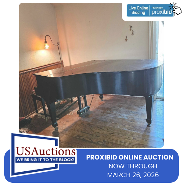 Black grand piano on hardwood floor